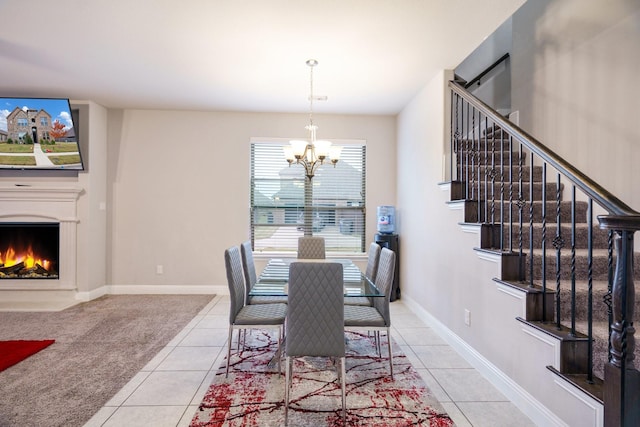 tiled dining room featuring a notable chandelier