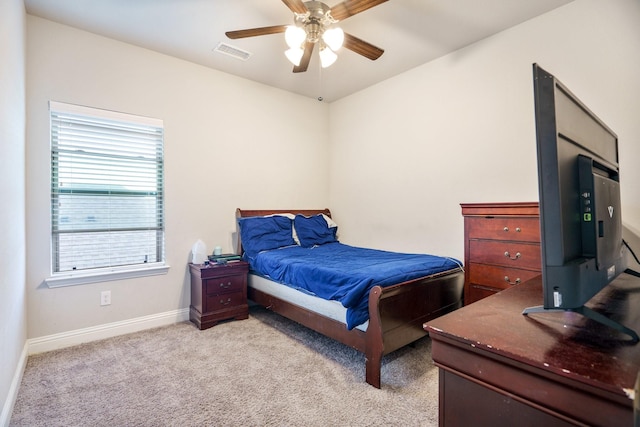 bedroom featuring light colored carpet and ceiling fan