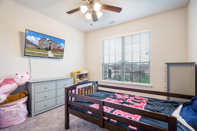 carpeted bedroom with ceiling fan