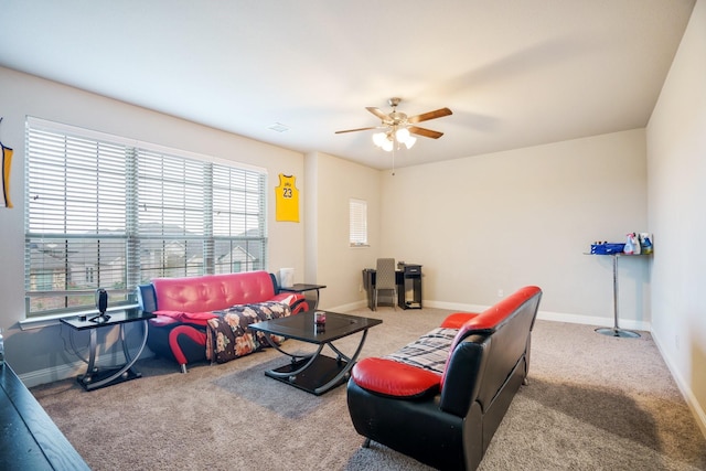 carpeted living room with ceiling fan and a wealth of natural light