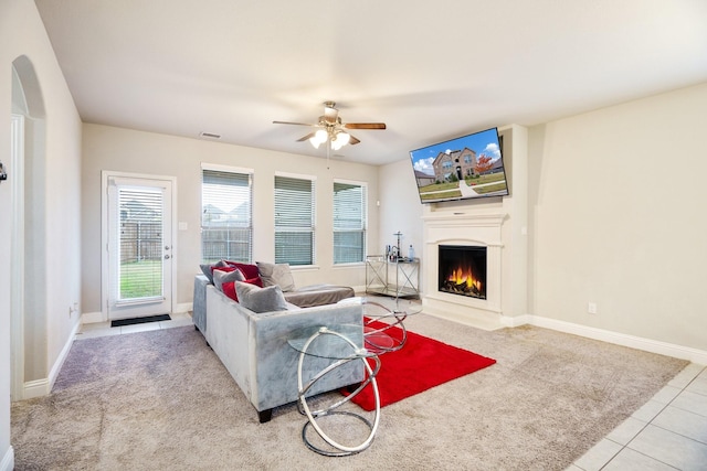 carpeted living room featuring ceiling fan