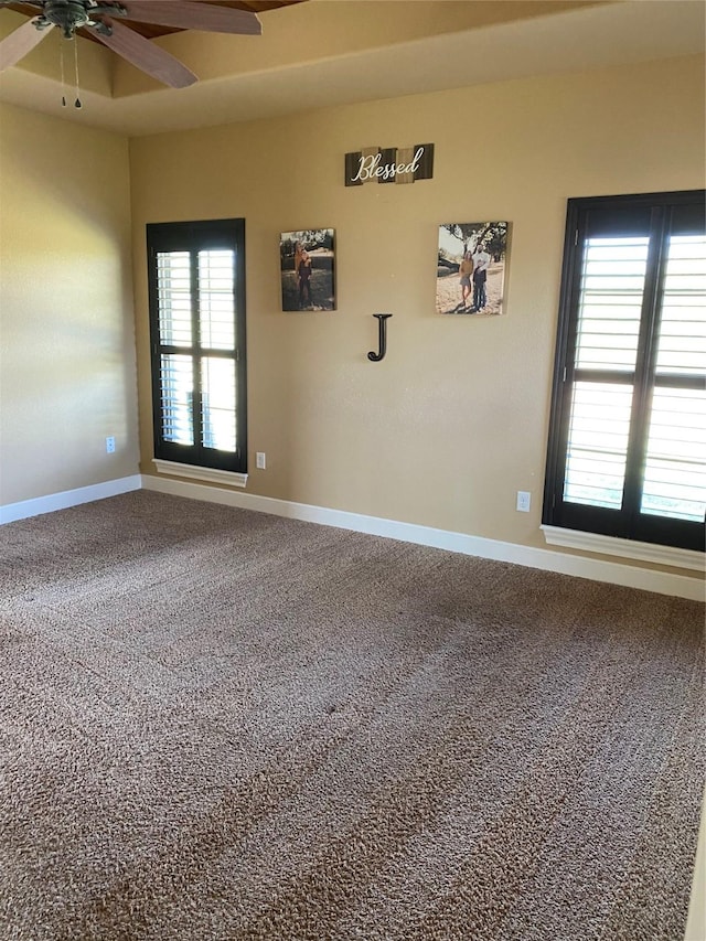 unfurnished room featuring carpet floors and ceiling fan