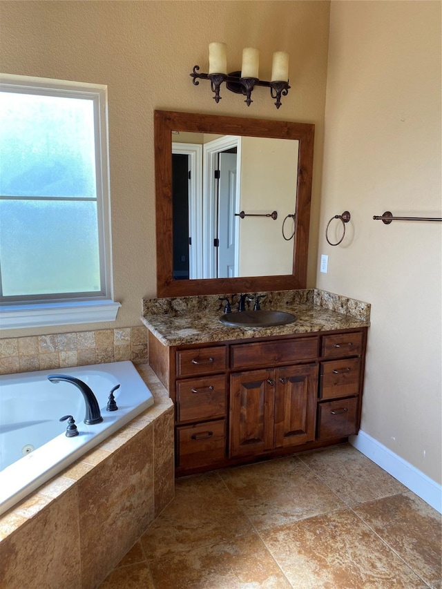 bathroom with vanity and tiled bath