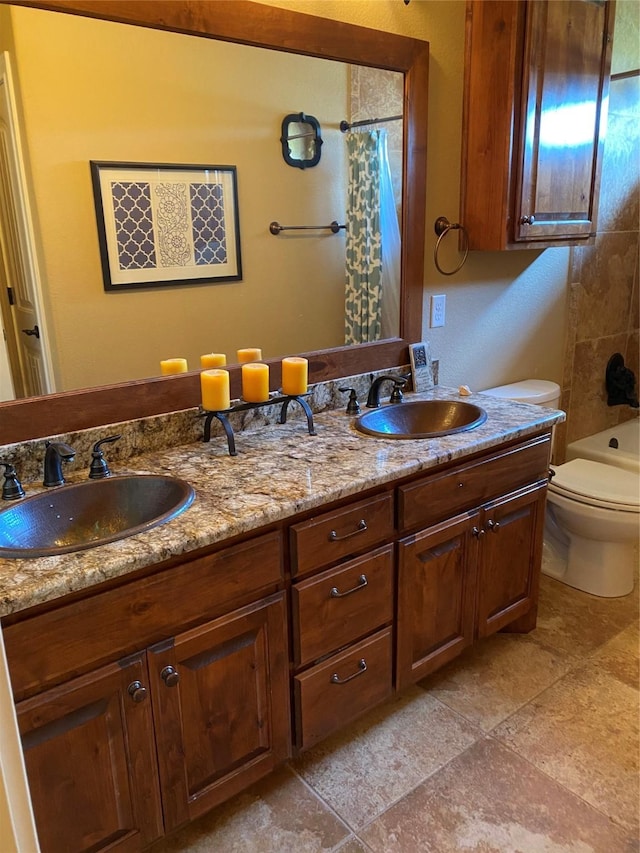 full bathroom featuring vanity, shower / tub combo, and toilet