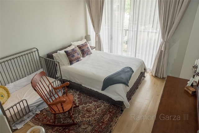 bedroom with light wood-type flooring