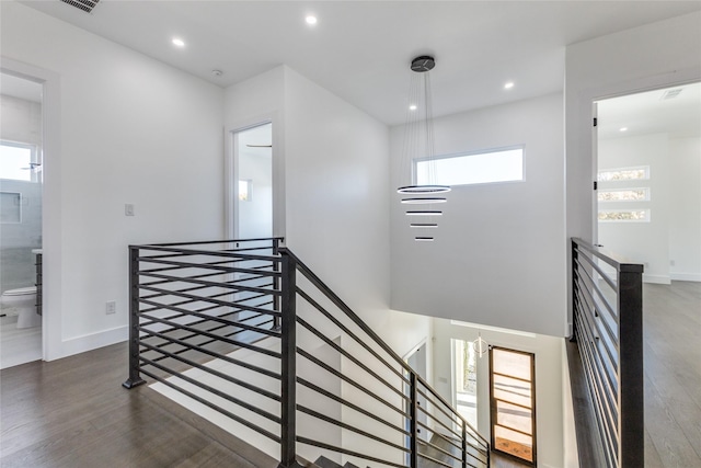 staircase featuring hardwood / wood-style flooring