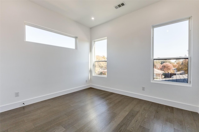 unfurnished room featuring dark hardwood / wood-style floors