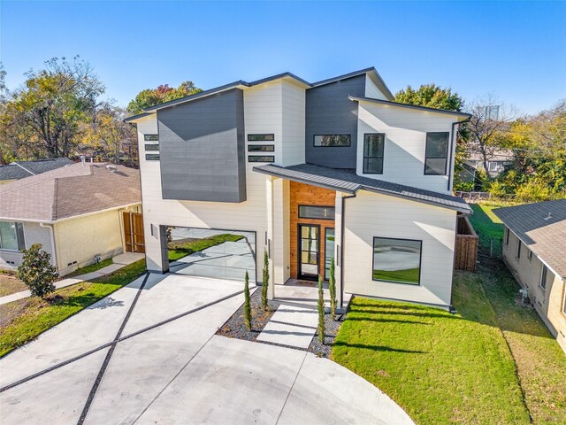 contemporary home with a front lawn