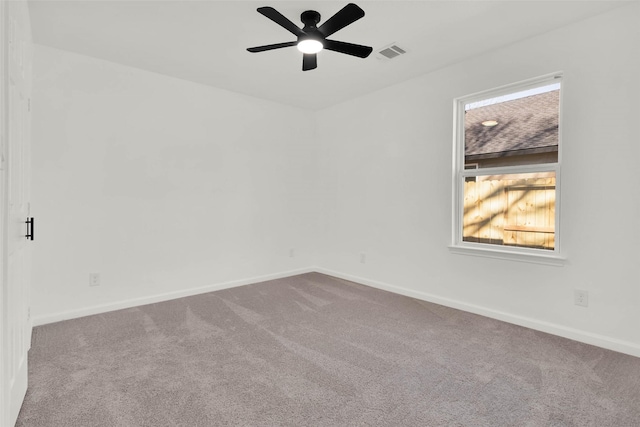 unfurnished room with ceiling fan and carpet flooring