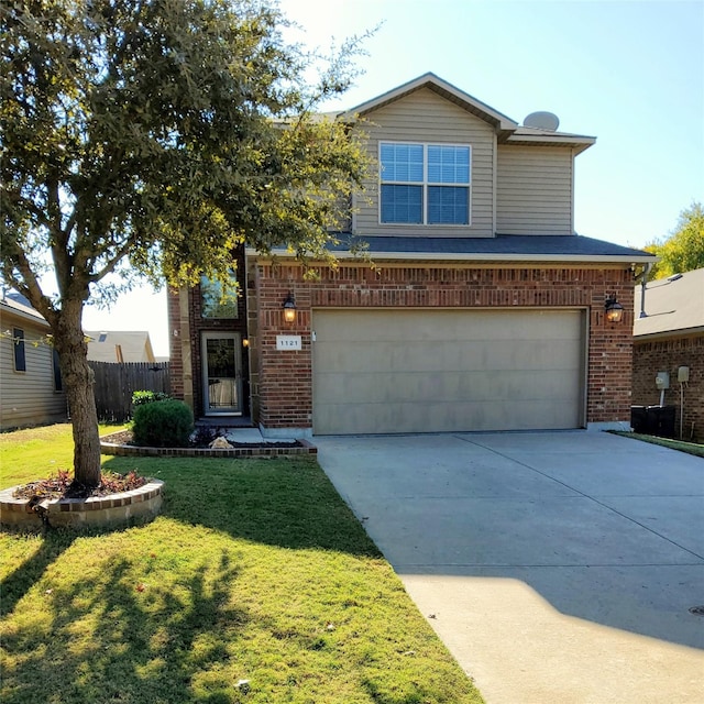 view of property with a garage and a front lawn