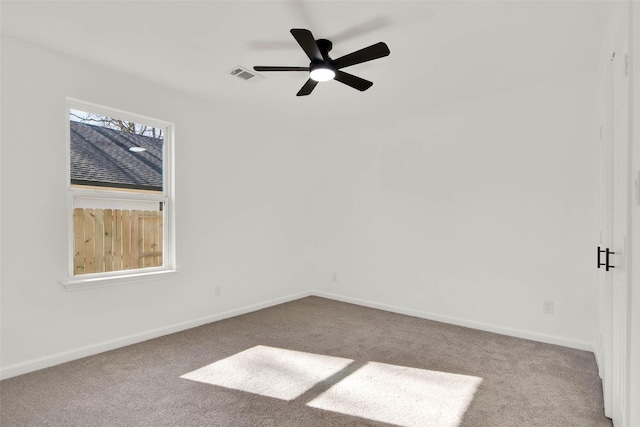 unfurnished room featuring ceiling fan and light colored carpet