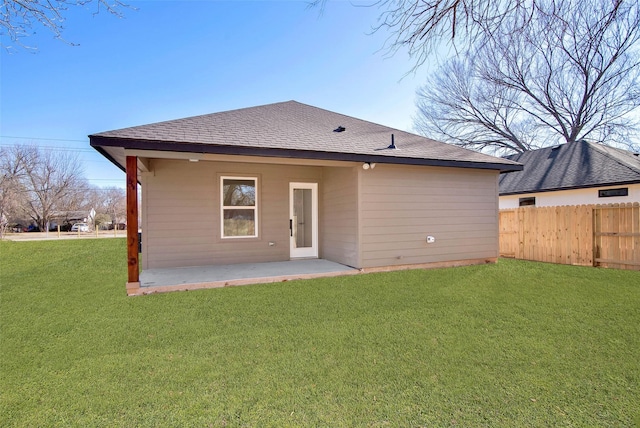 rear view of house with a patio area and a yard