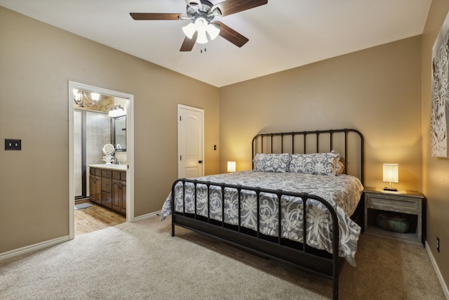 carpeted bedroom featuring connected bathroom and ceiling fan