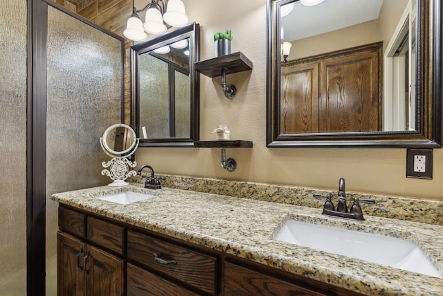 bathroom featuring vanity and an enclosed shower