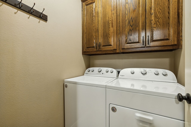 laundry area with cabinets and washer and dryer