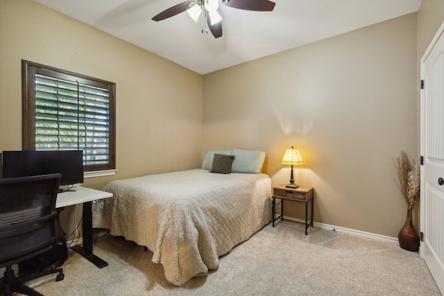 bedroom with light carpet and ceiling fan