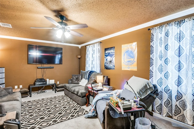 living area with a textured ceiling, carpet floors, visible vents, a ceiling fan, and ornamental molding