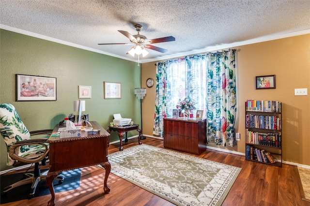 office area featuring a textured ceiling, ceiling fan, ornamental molding, and dark wood-type flooring