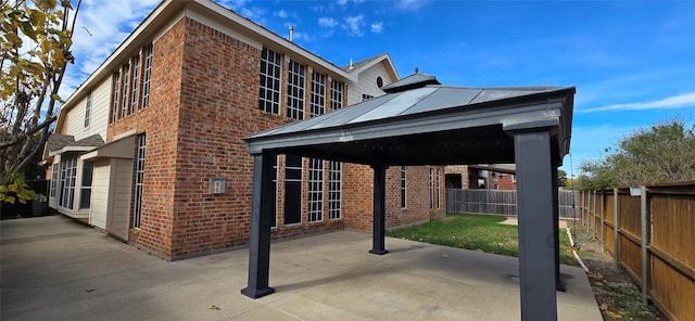 view of home's exterior with a patio area