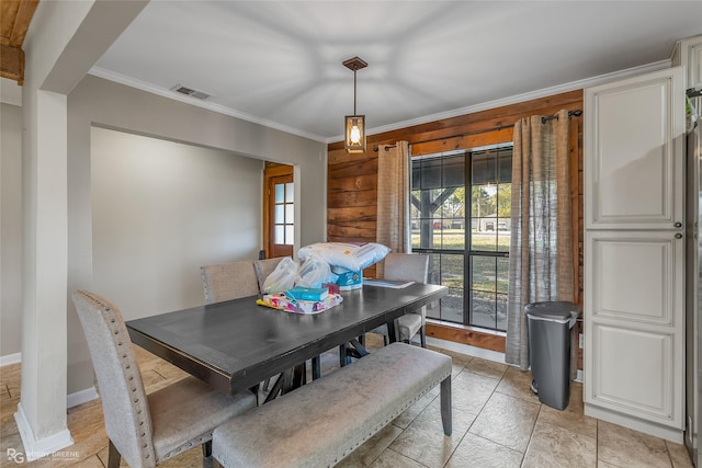 dining area featuring crown molding