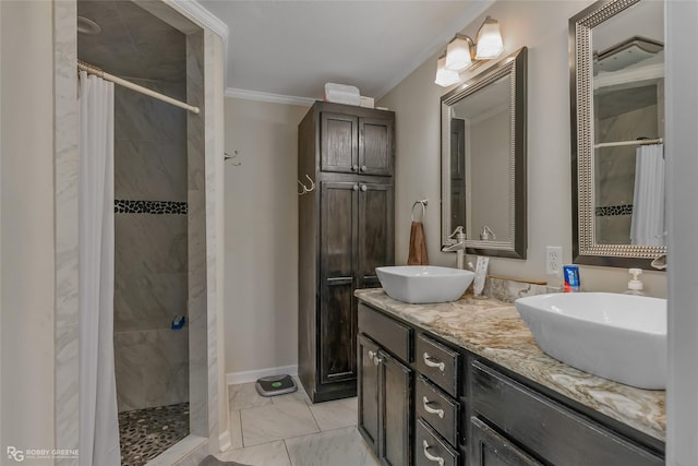 bathroom with ornamental molding, curtained shower, and vanity