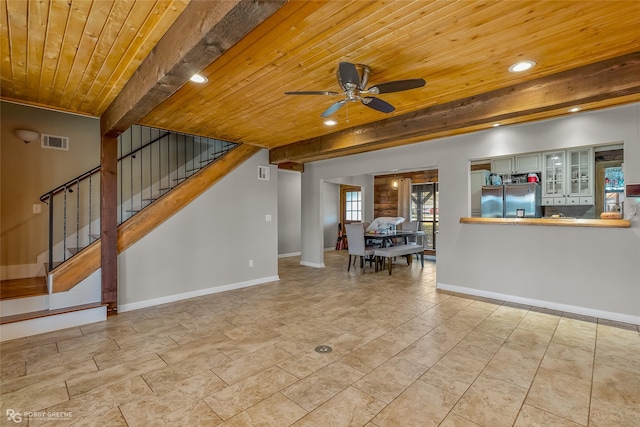 unfurnished living room with beam ceiling, wooden ceiling, and ceiling fan