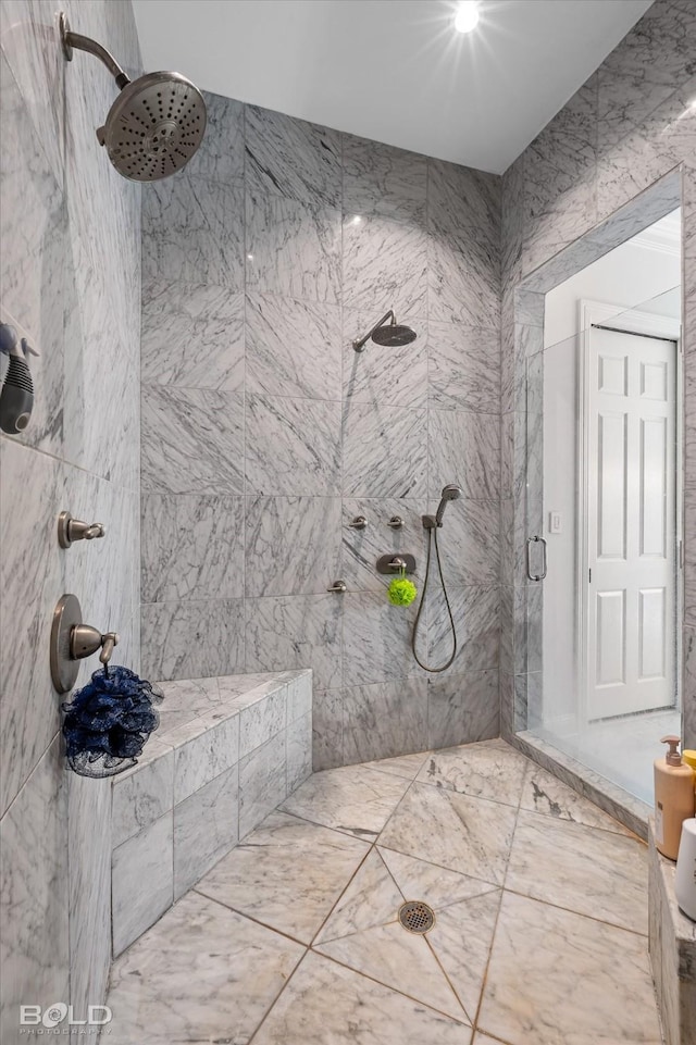 bathroom featuring a tile shower and tile walls