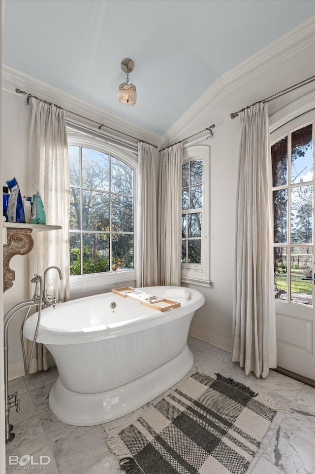 bathroom featuring crown molding, a tub, and vaulted ceiling