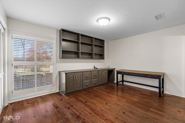 office space with dark hardwood / wood-style flooring