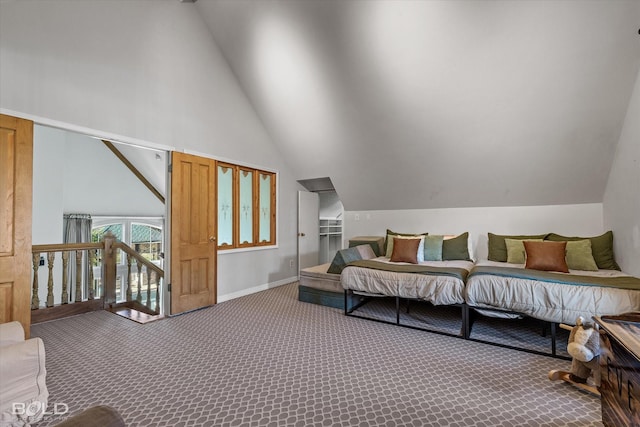 bedroom with lofted ceiling and carpet floors