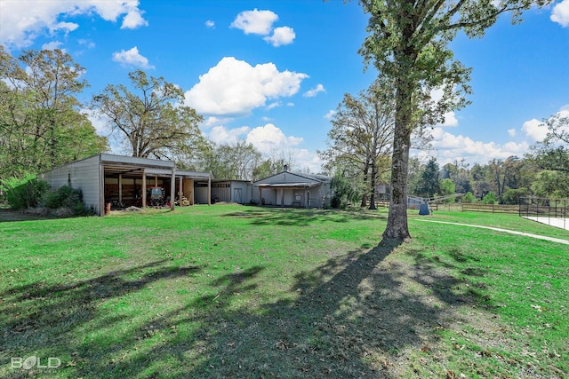 view of yard with an outdoor structure