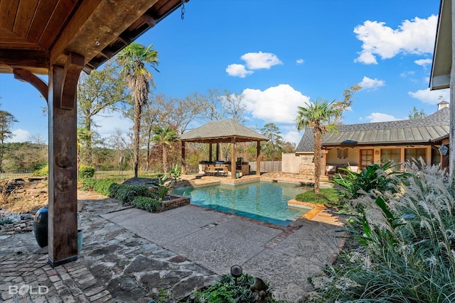 view of swimming pool featuring a gazebo and a patio