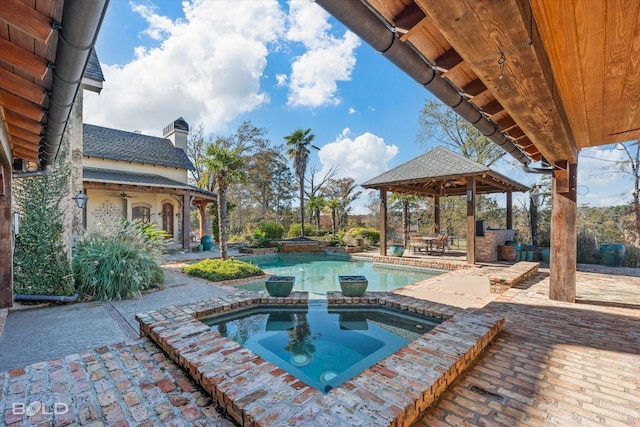 view of pool with a gazebo, an in ground hot tub, and a patio