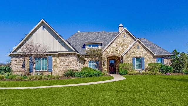 view of front of home with a front lawn