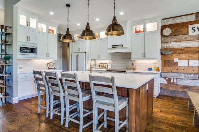 kitchen featuring white cabinetry, dark wood-type flooring, and appliances with stainless steel finishes