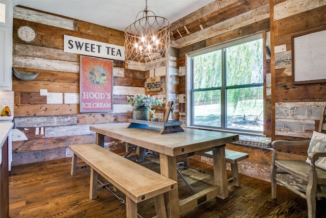 dining room with a notable chandelier and dark hardwood / wood-style floors