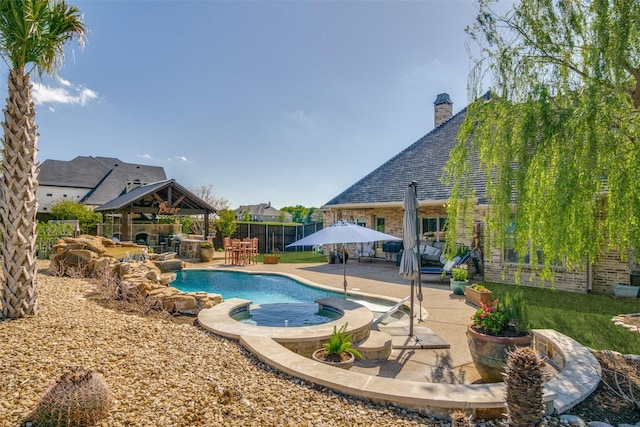 view of swimming pool with a gazebo and a patio