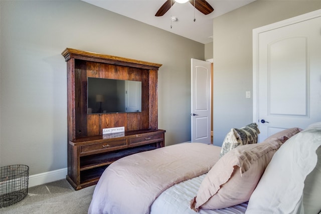 bedroom featuring light carpet and ceiling fan