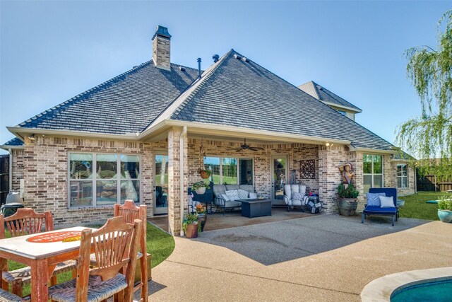 back of house with ceiling fan, a patio, and an outdoor hangout area