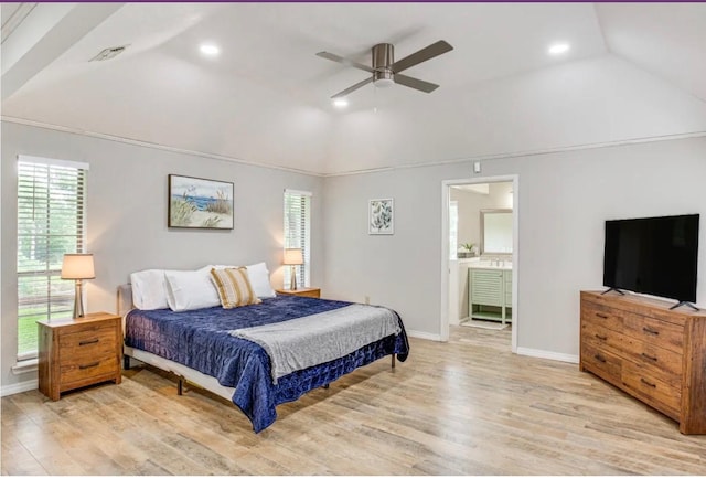 bedroom with ceiling fan, light wood-type flooring, ensuite bathroom, and lofted ceiling