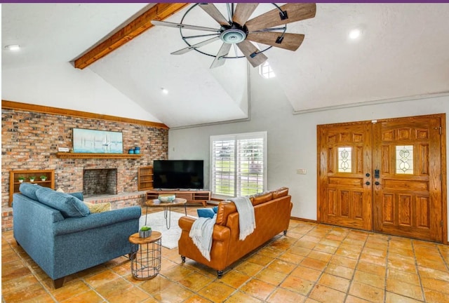 living room featuring beamed ceiling, ceiling fan, high vaulted ceiling, and a brick fireplace