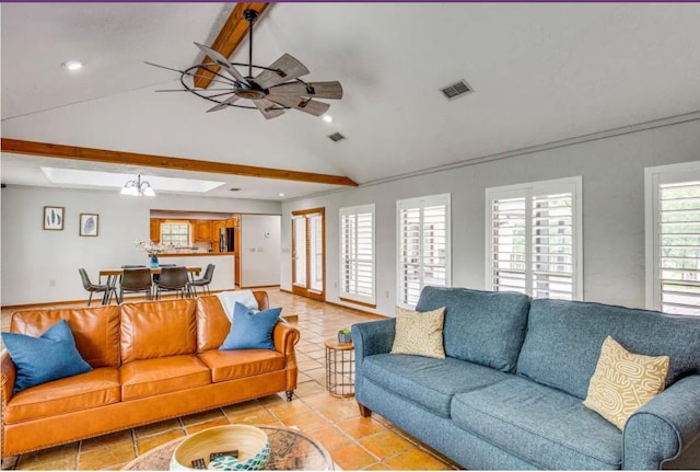 tiled living room with lofted ceiling with beams and ceiling fan with notable chandelier