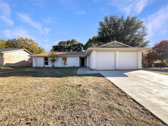 ranch-style house with a garage and a front lawn