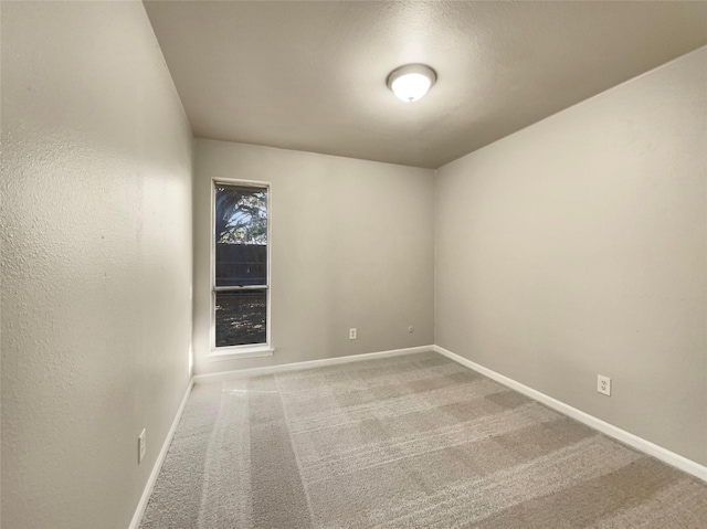 spare room featuring carpet floors