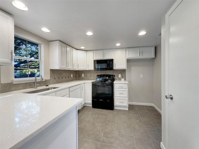 kitchen featuring black appliances, backsplash, white cabinets, and sink