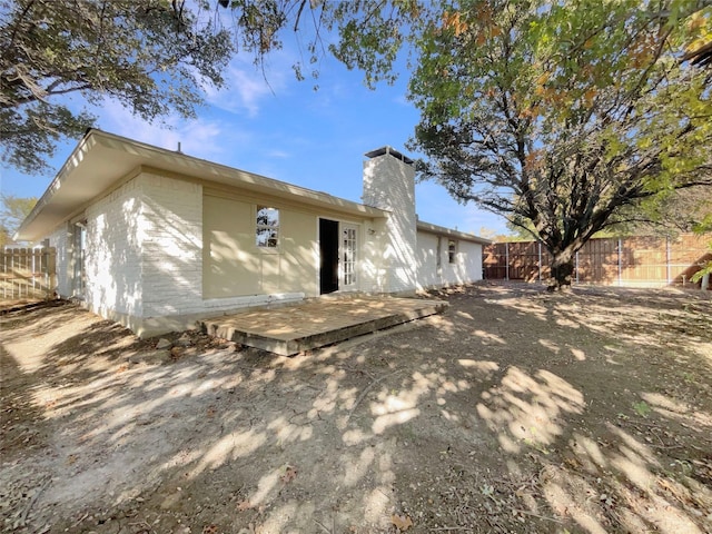 back of house featuring a deck