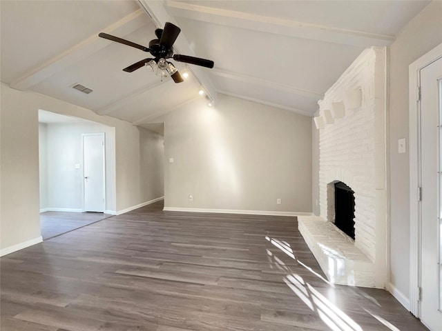 unfurnished living room featuring hardwood / wood-style flooring, lofted ceiling with beams, ceiling fan, and a brick fireplace