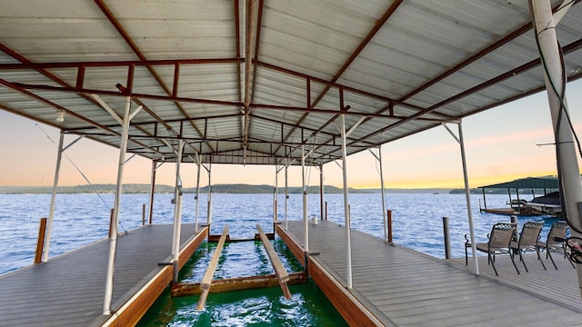 dock area with a water view and boat lift