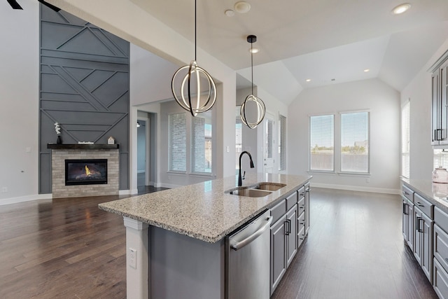 kitchen with dishwasher, sink, hanging light fixtures, lofted ceiling, and gray cabinets