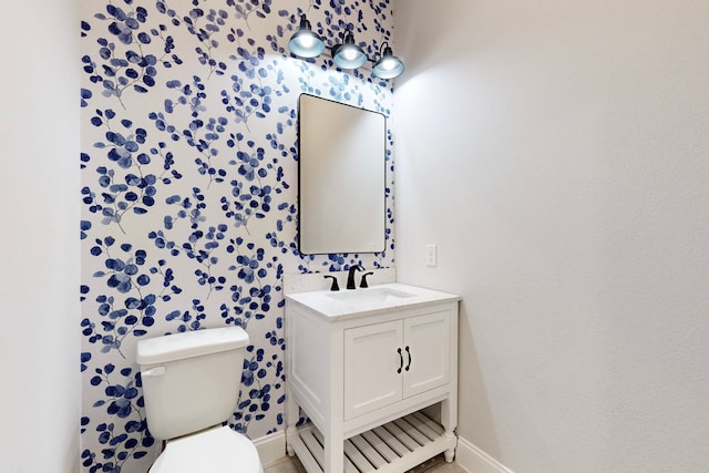 bathroom with vanity and toilet